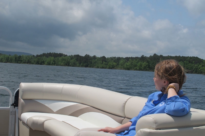 A pontoon ride across Lake Ouachita is a great way to watch the waves and the surrounding woods. 