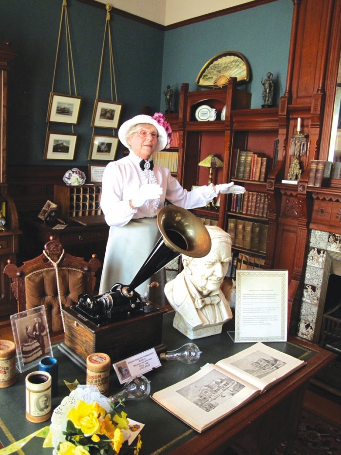 Hearthstone costumed interpreter Clare Hilgendorf gives guided tours and provides information on the wealthy Henry Rogers who spared no cost in building his house for his wife, Cremora, and who was ahead of his time in bringing electricity in. (Pamela O’Meara/Review)