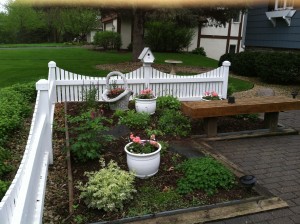 This simple entry garden is welcoming even in early spring. 